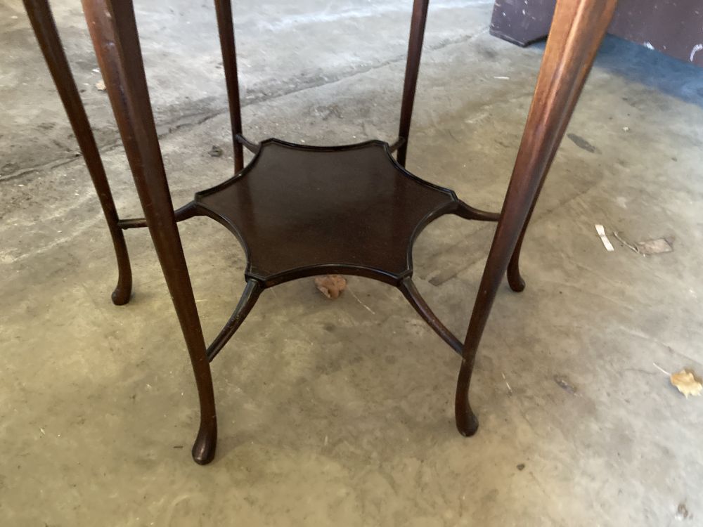 A late Victorian mahogany shaped circular topped two tier table, 67cm diameter, 72cm high